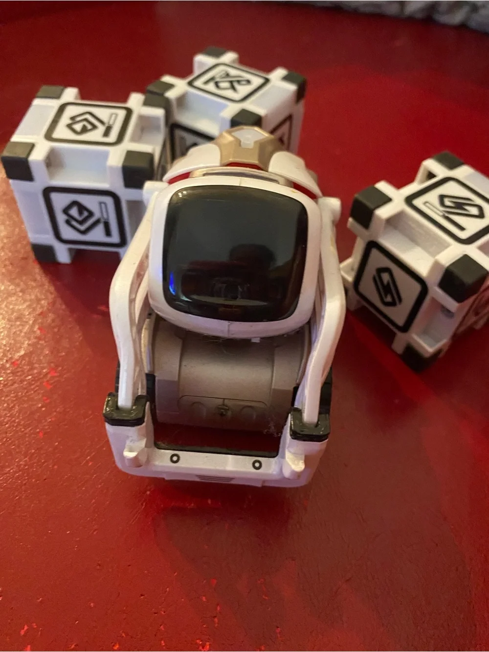 Cozmo Robot Toy - White and Black Interactive Companion with three cubes.